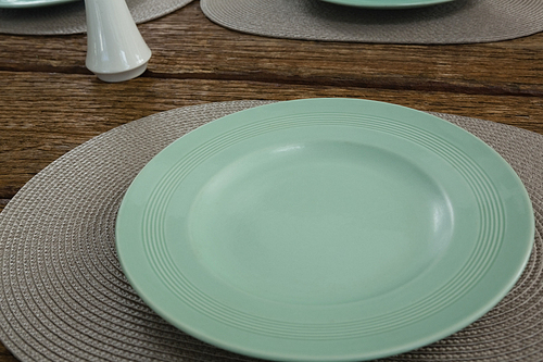 Close-up of empty plate on a placemat