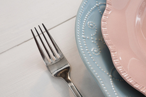 Close-up of elegance table setting on wooden plank