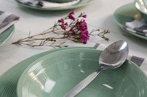 Close-up of elegance table setting on wooden plank