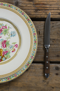 Close-up of elegance table setting on wooden plank