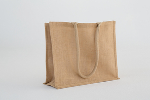 Close-up of jute bag on white background