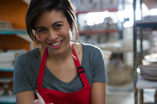 Close-up of happy female potter