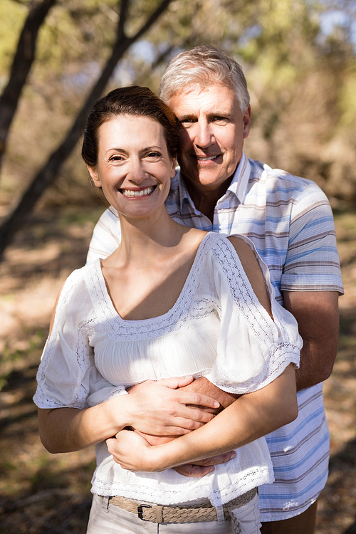 Portrait of romantic couple embracing each other during safari vacation