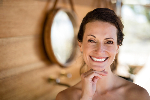 Portrait of beautiful woman in cottage during safari vacation