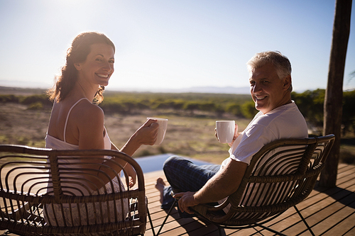 Portrait of senior couple having coffee while sitting at the resort