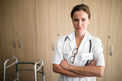 Portrait of confident female doctor at nursing home