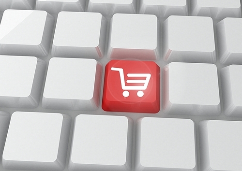Conceptual image of online shopping with red key of shopping cart on keyboard