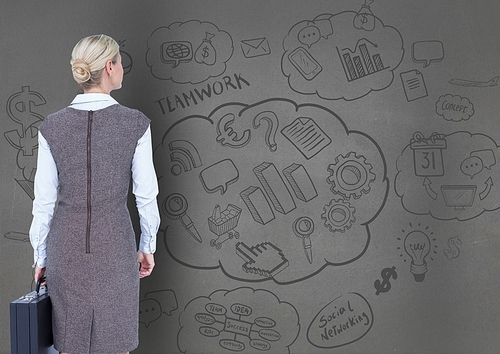 Digital composition of businesswoman looking at business plan concept on blackboard