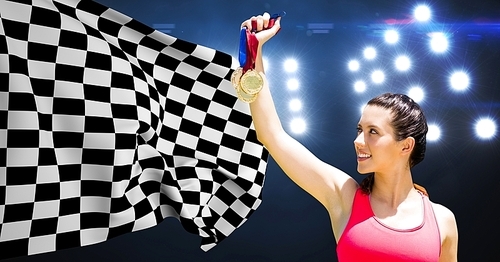 Composite image of athlete holding medals against checkered flag in stadium