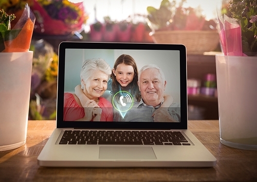 Incoming video call of grandparents and grand daughter on laptop