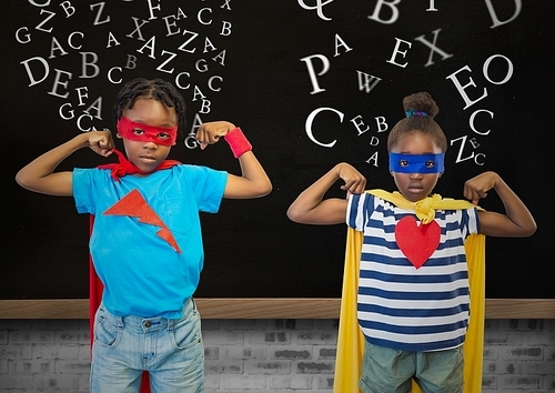 Digital composition of kids in superhero costume flexing their arms against blackboard in background