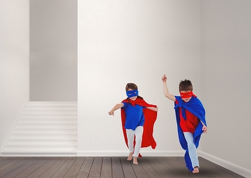 Cute kids in superhero costume playing at home