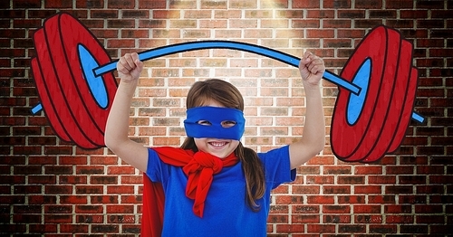 Digital composition of girl in superhero costume pretending to lift weights against wooden background