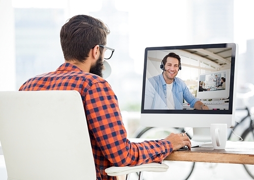 Man having video call with his colleague at office