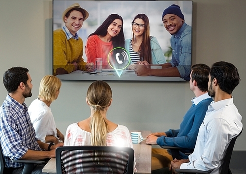 Business conference call on television in office