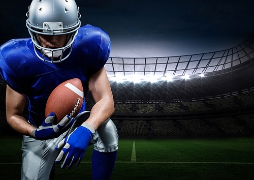 Digitally composite of american football player posing with rugby ball in stadium
