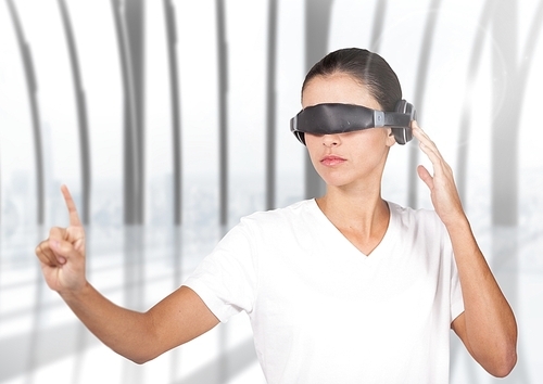 Woman in virtual reality glasses using digital screen at home