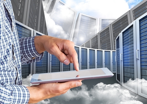 Digital composite image of businessman using digital tablet against server tower with cloudy background
