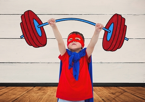 Boy wearing superhero costume lifting heavy weight against digitally generated background