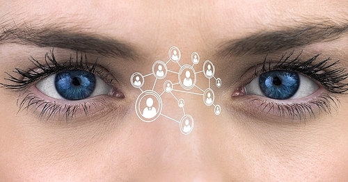 Digital composite image of womans blue eyes with interface screen