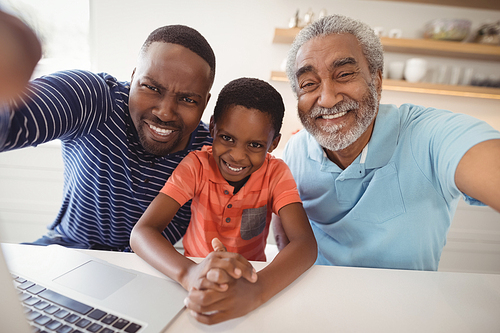 Happy multi-generation family  in kitchen