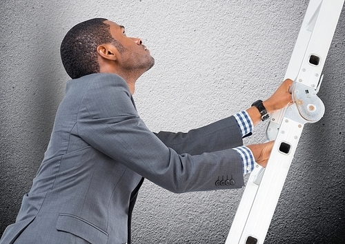 Digital composition of businessman climbing a ladder against grey background