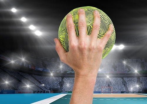 Digital composition of athlete throwing handball against stadium in background