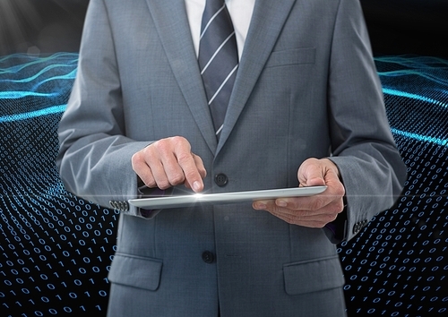 Digital composite image of businessman using digital tablet against binary code interface in background