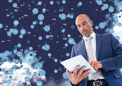 Digital composite image of businessman using digital tablet against cloud computing background