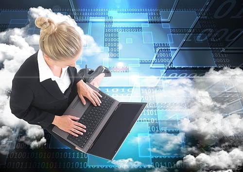 Digital composite image of businesswoman working on laptop against web binary code background