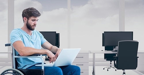 bearded man sitting in . and using laptop