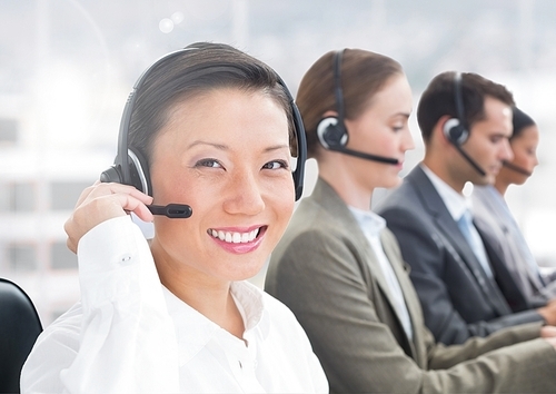 Digital composition of happy woman talking on headset in call centre