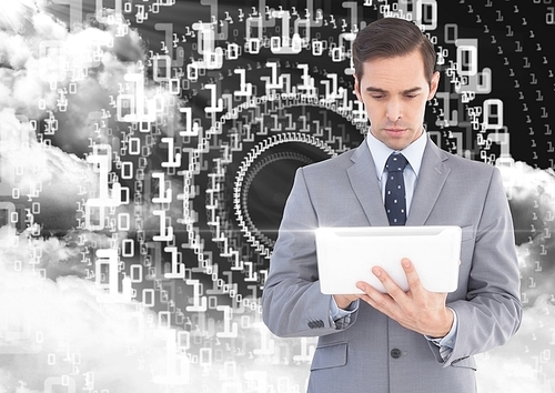 Digital composition of businessman using digital tablet with binary codes and cloud in background