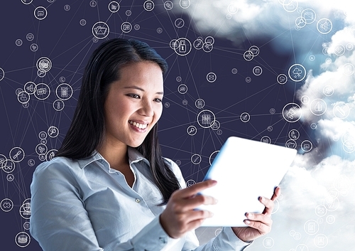 Digital composition of happy woman holding digital tablet and connecting icons with cloud in background