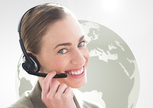 Digital composition of happy woman talking on headset with globe in background