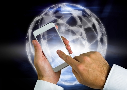 Digital composite of Hand touching cell phone screen against bright graphic sphere