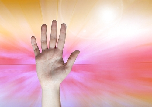 Digital composite of  open Hand against colored background