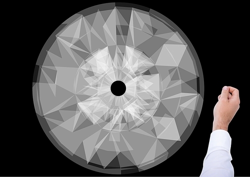 Digital composite of Hand against futuristic Circle Wheel on black background