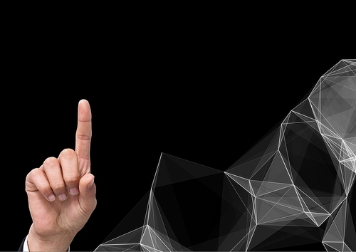 Digital composite of Hand Pointing against graphic Polygons on dark background