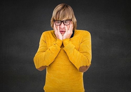 Digital composite of stunned Man in yellow against grey background