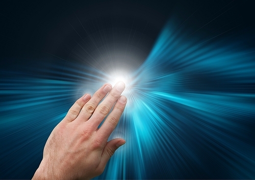 Digital Composite Image of Hand touching virtual screen against a blue background