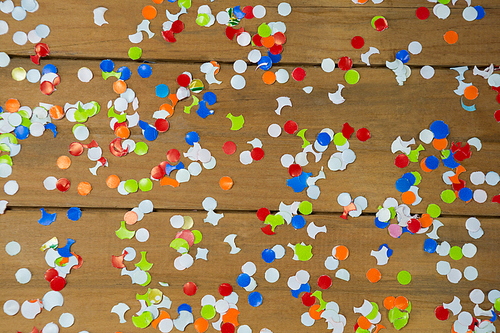 Overhead of confetti on wooden surface