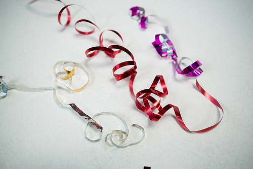 Overhead of colorful ribbons on white background