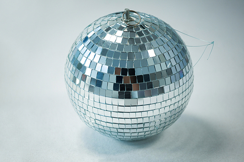 Close-up of mirror ball on white background