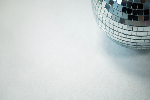 Close-up of mirror ball on white background