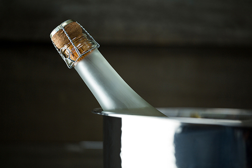 Close-up of champagne bottle in a silver ice bucket