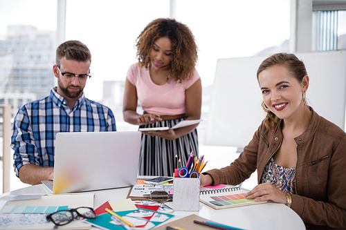 Attentive team of executives working together in the office