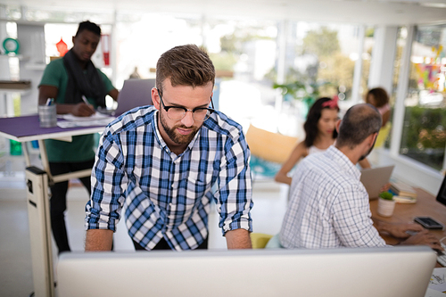 Attentive male executive working on computer in the office