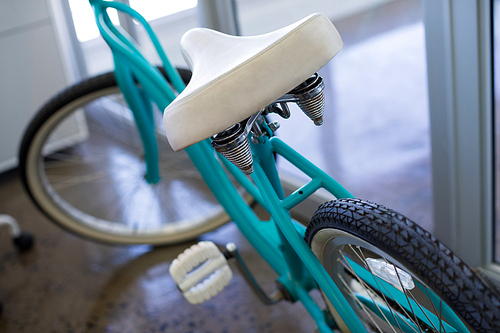 Close-up of bicycle near office door