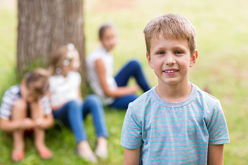 Portrait of a boy smiling in park